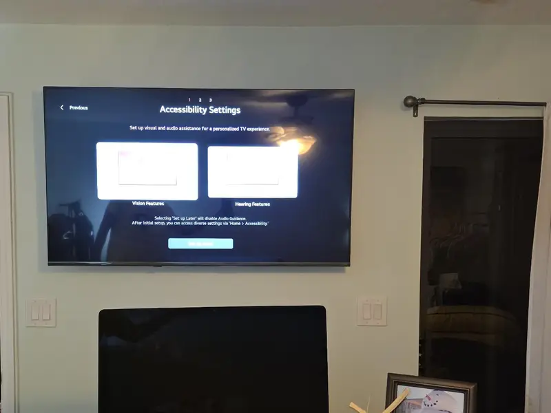 Bedroom TV mounted on the wall in Merritt Island, FL, showing the first-time setup screen